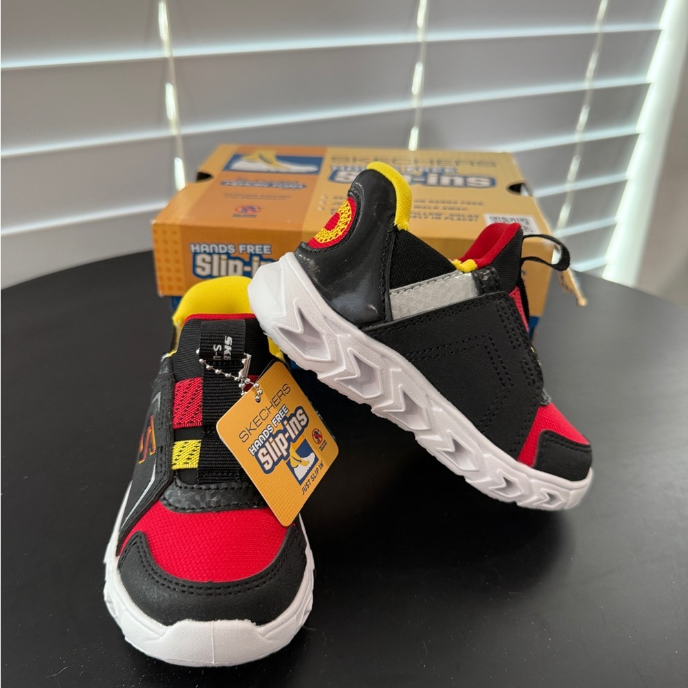 NWT Skechers light up Kids' Black, Red, and Yellow Slip-On Sneakers